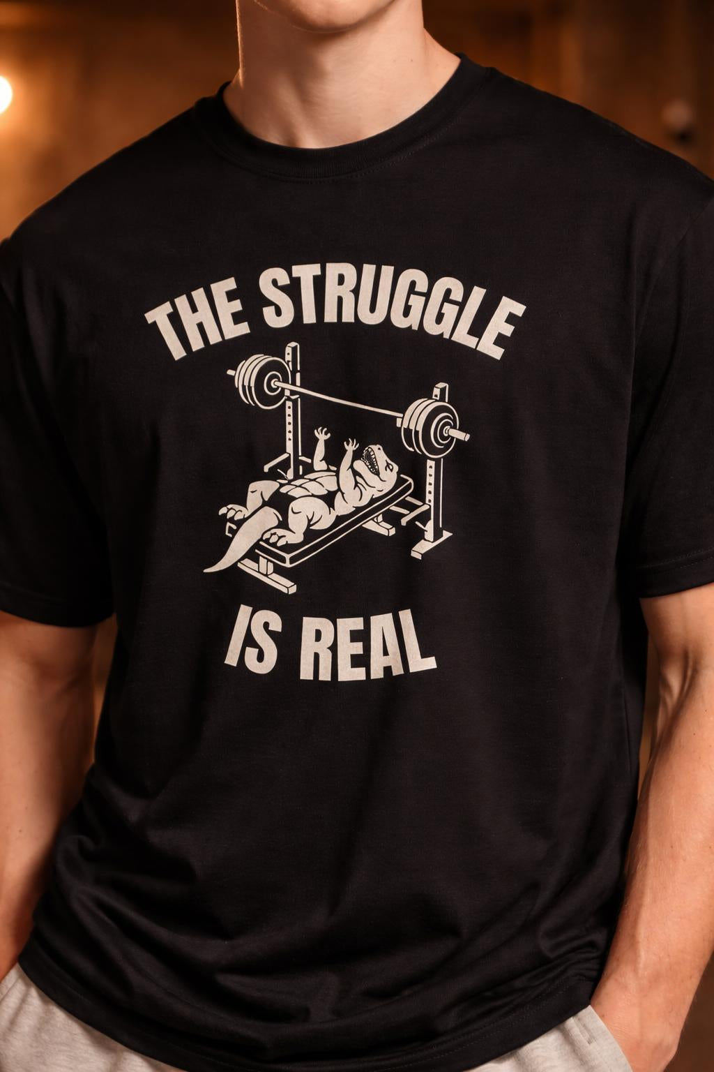 Detail shot of Short Arms Struggle Organic Cotton Tee - Eco-Friendly Dinosaur Gym Wear